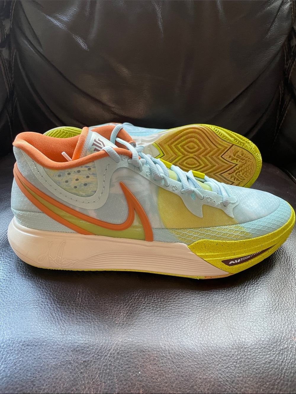 Nike men’s Light Blue Running Shoes with Coral & Lime Accents